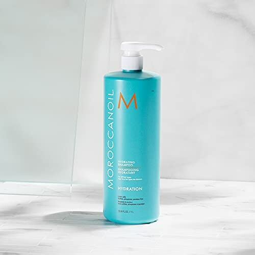 Moroccanoil Hydrating Shampoo bottle on marble surface