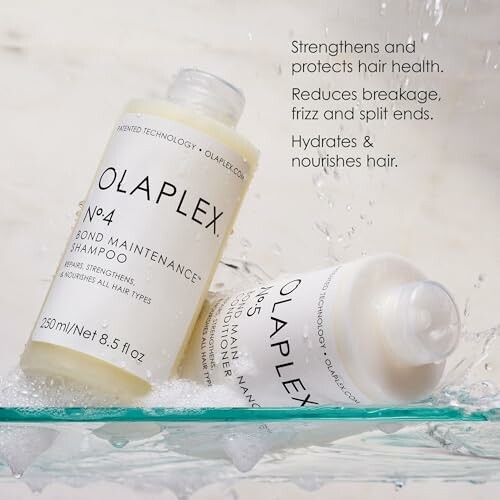 Two Olaplex shampoo bottles with water splashes