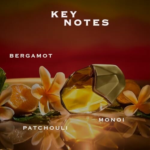 Perfume bottle with key notes of bergamot, patchouli, and monoi.