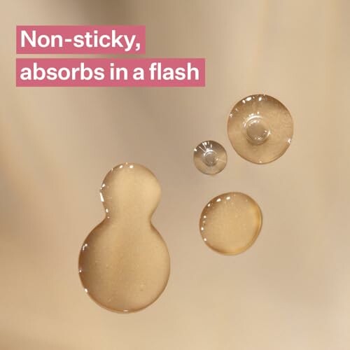 Close-up of liquid drops with text 'Non-sticky, absorbs in a flash'.