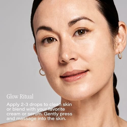Woman with glowing skin promoting skincare glow ritual.
