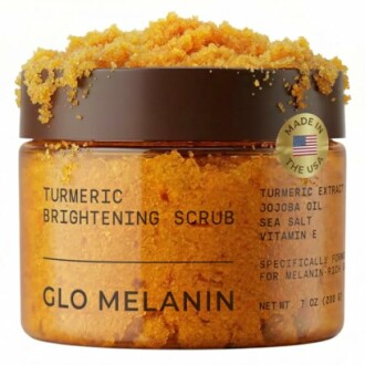 Glo Melanin turmeric brightening scrub jar with exfoliating crystals.