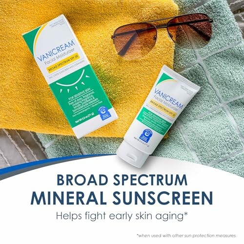 Vanicream mineral sunscreen tube and box on towels with sunglasses.